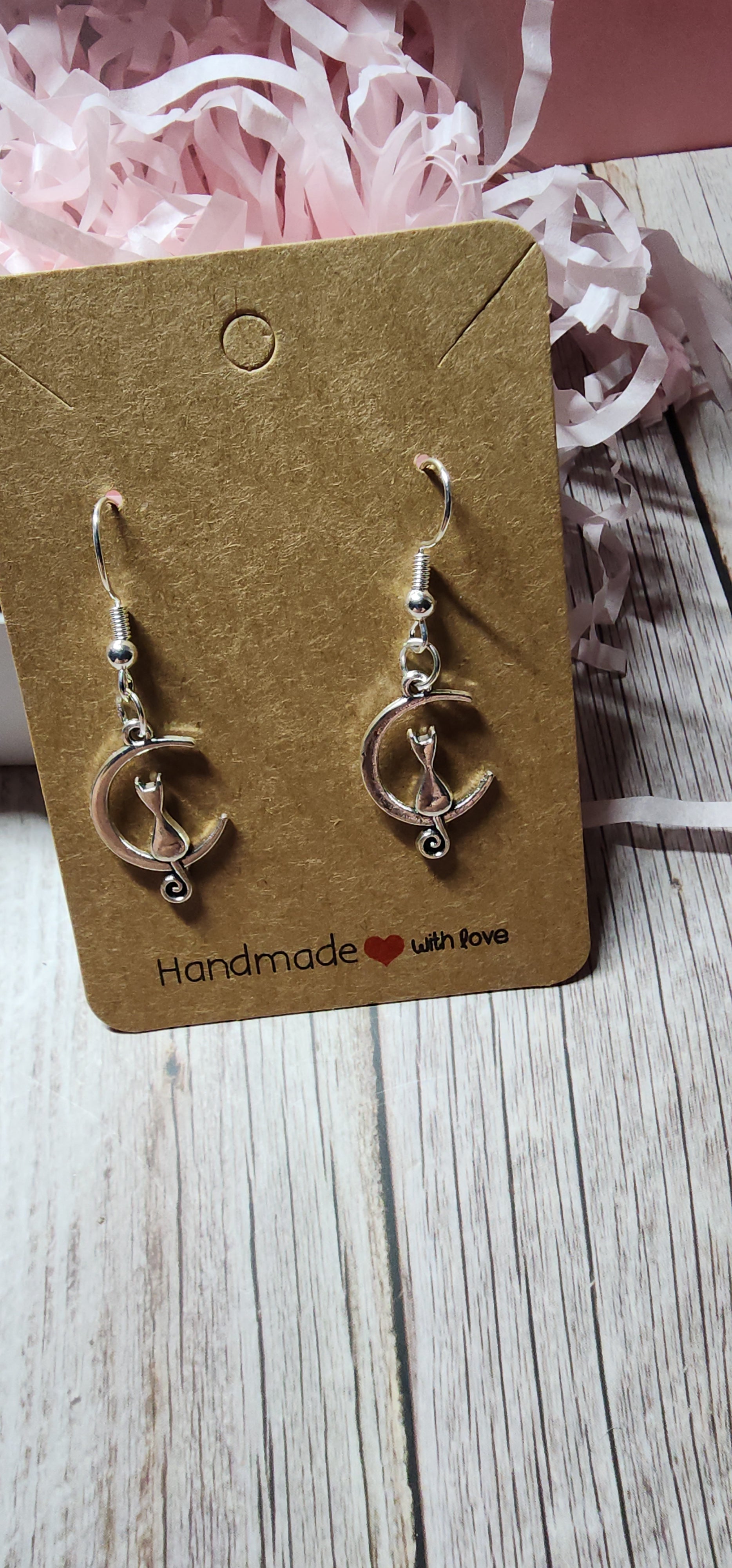 Boho style silver celestial dangle earrings sun moon and star charms