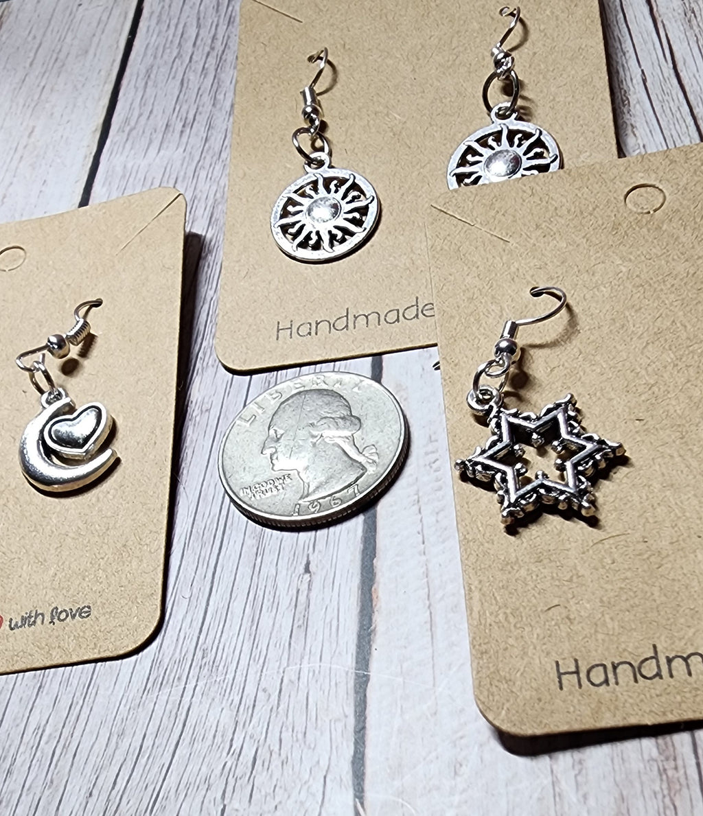 Boho style silver celestial dangle earrings sun moon and star charms