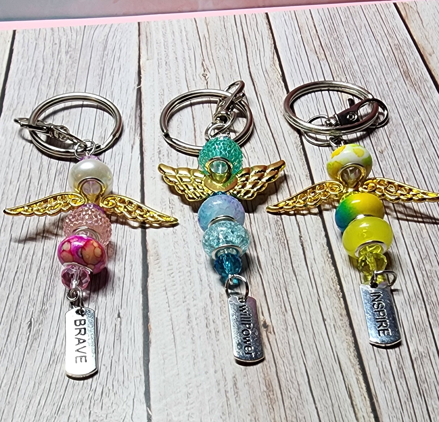 European glass beaded keychain, angel wings, sloth, turtle, sunflower charms, inspiration charm.