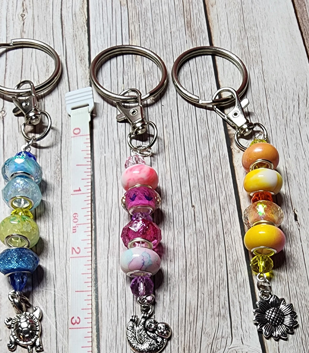 European glass beaded keychain, angel wings, sloth, turtle, sunflower charms, inspiration charm.