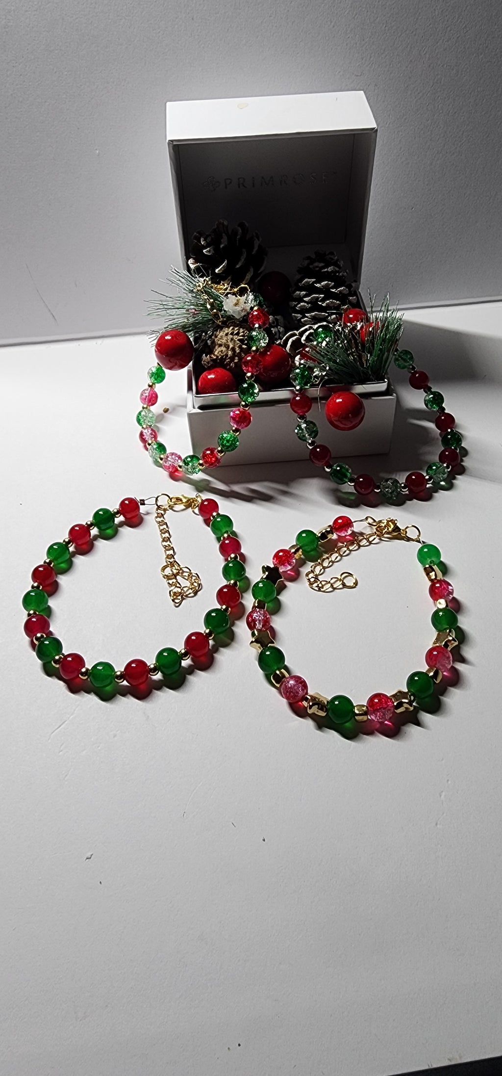 Elegant red and green glass bead Christmas bracelets with dazzling gold accents and spacer beads.  Christmas gift,  festive holiday jewelry.