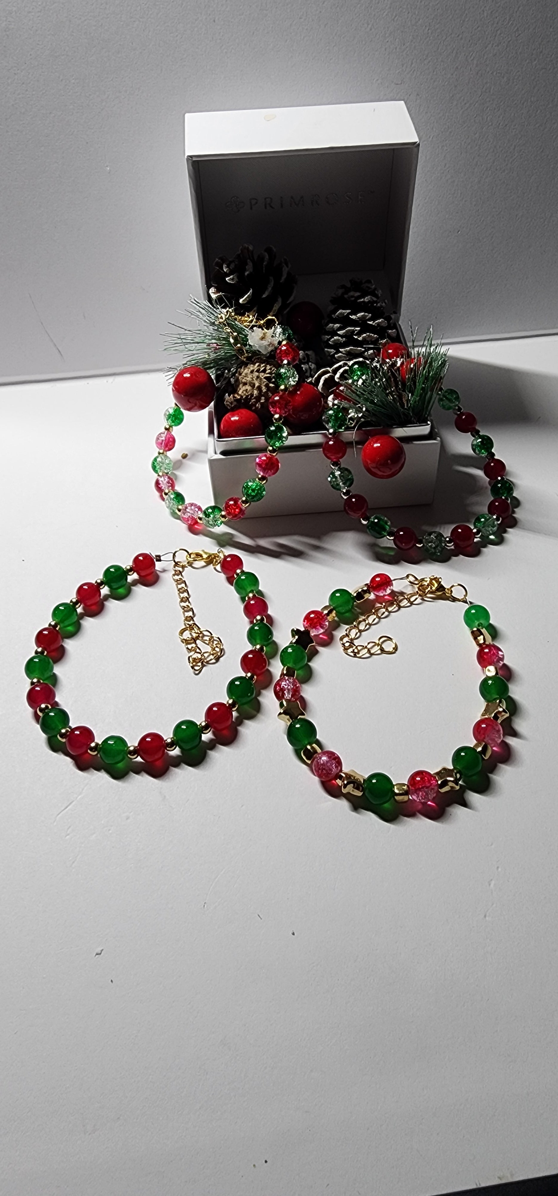 Elegant red and green glass bead Christmas bracelets with dazzling gold accents and spacer beads.  Christmas gift,  festive holiday jewelry.