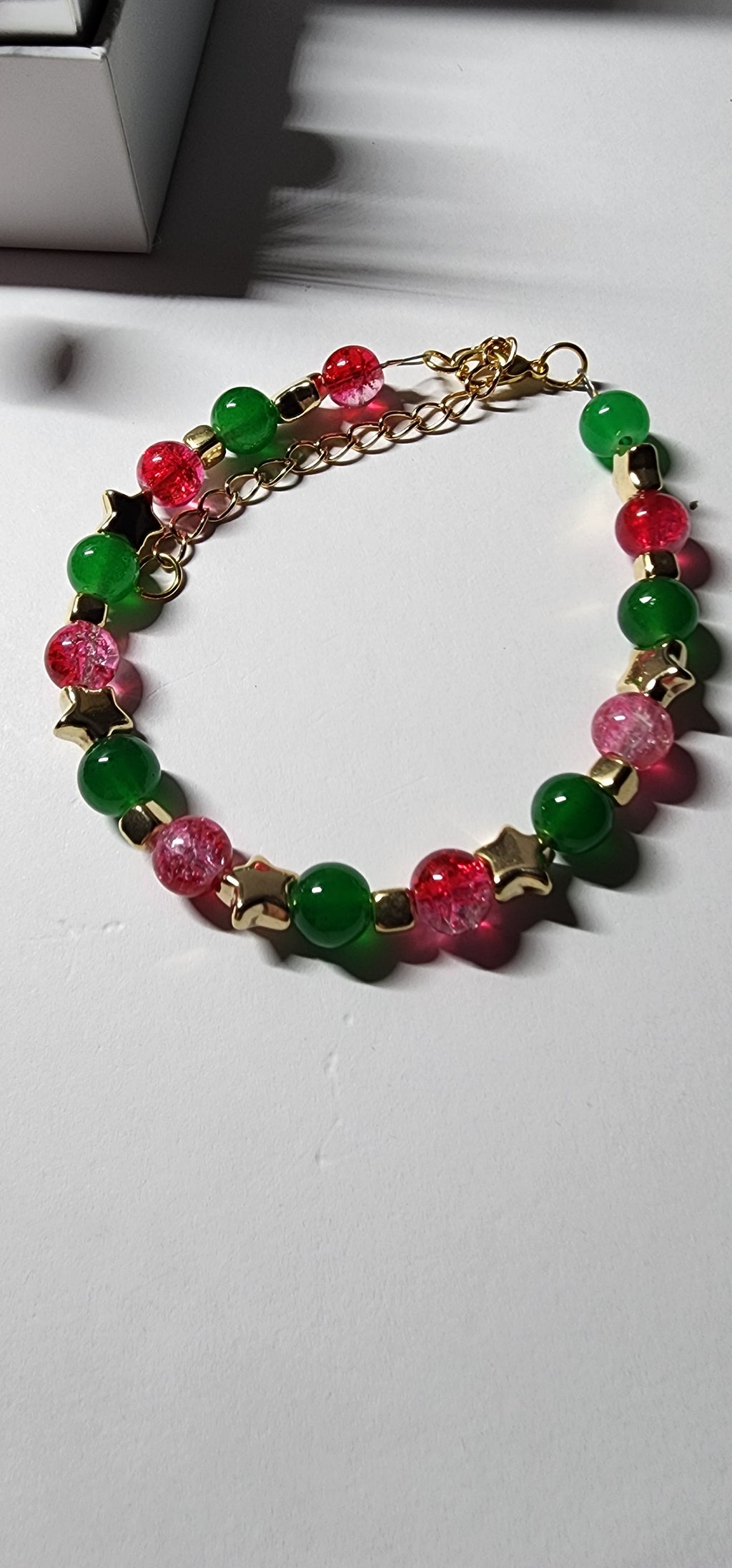 Elegant red and green glass bead Christmas bracelets with dazzling gold accents and spacer beads.  Christmas gift,  festive holiday jewelry.