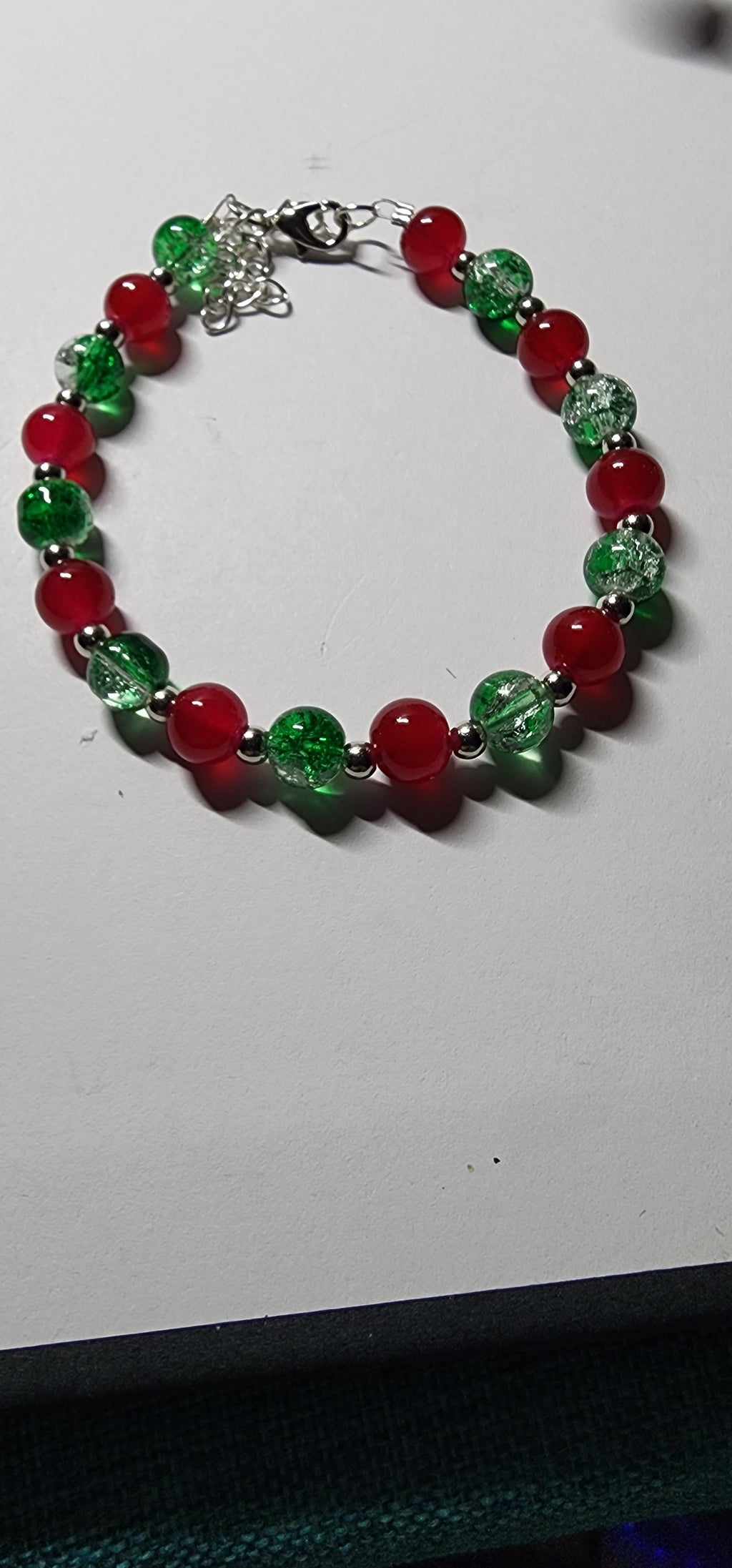 Elegant red and green glass bead Christmas bracelets with dazzling gold accents and spacer beads.  Christmas gift,  festive holiday jewelry.
