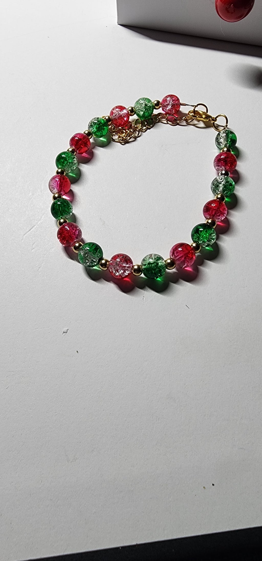 Elegant red and green glass bead Christmas bracelets with dazzling gold accents and spacer beads.  Christmas gift,  festive holiday jewelry.