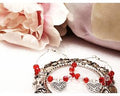 Valentines Day memory wire earrings with red glass beads and heart charm