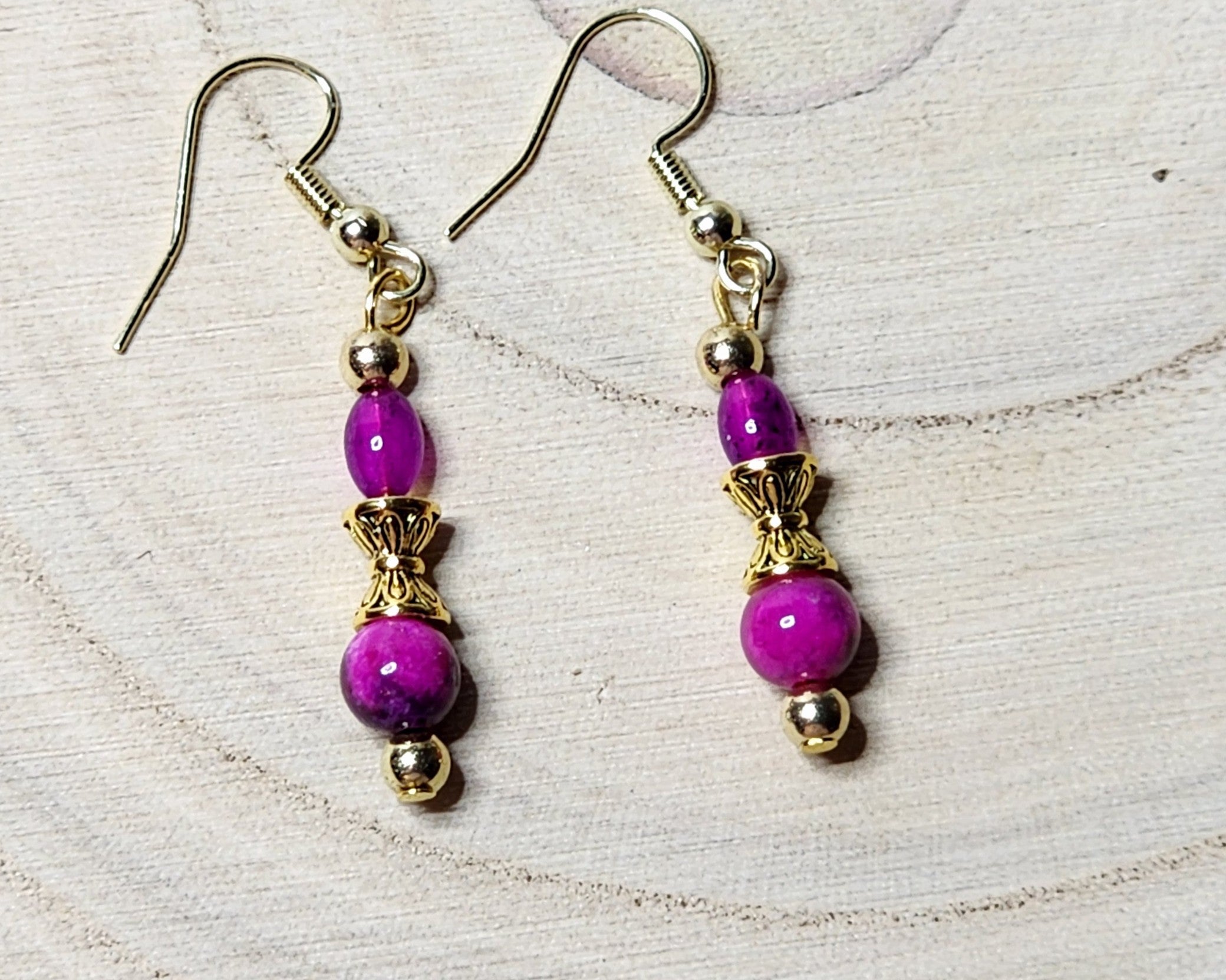 Dainty gemstone dangle earrings with dual sided gold tone bead caps