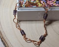 Handcrafted Copper Infinity Bracelet with Purple Beads – Unique Artisan Jewelry