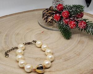 Faux Pearl Cream Colored Beads  And Gold Colored Glass Accent Bead