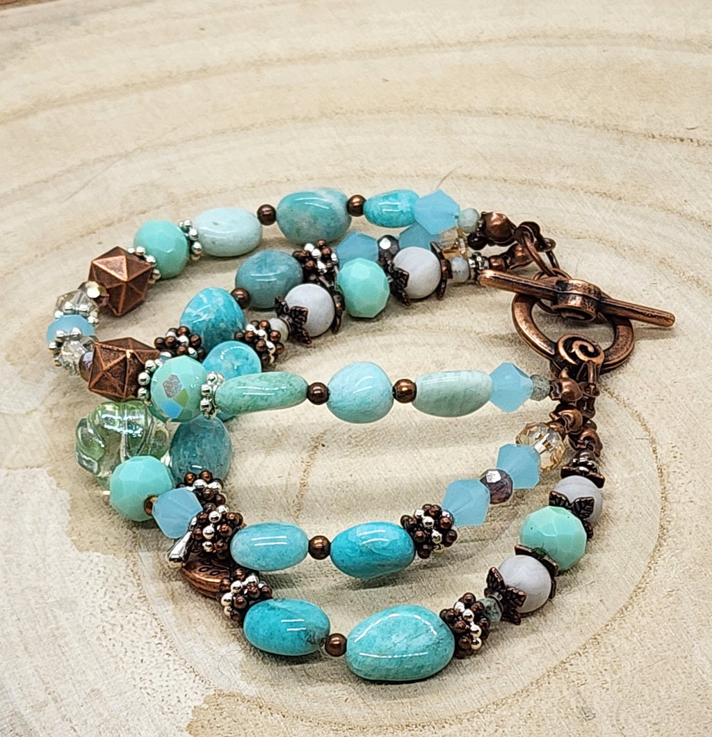 Turquoise beaded bracelet on a wooden surface