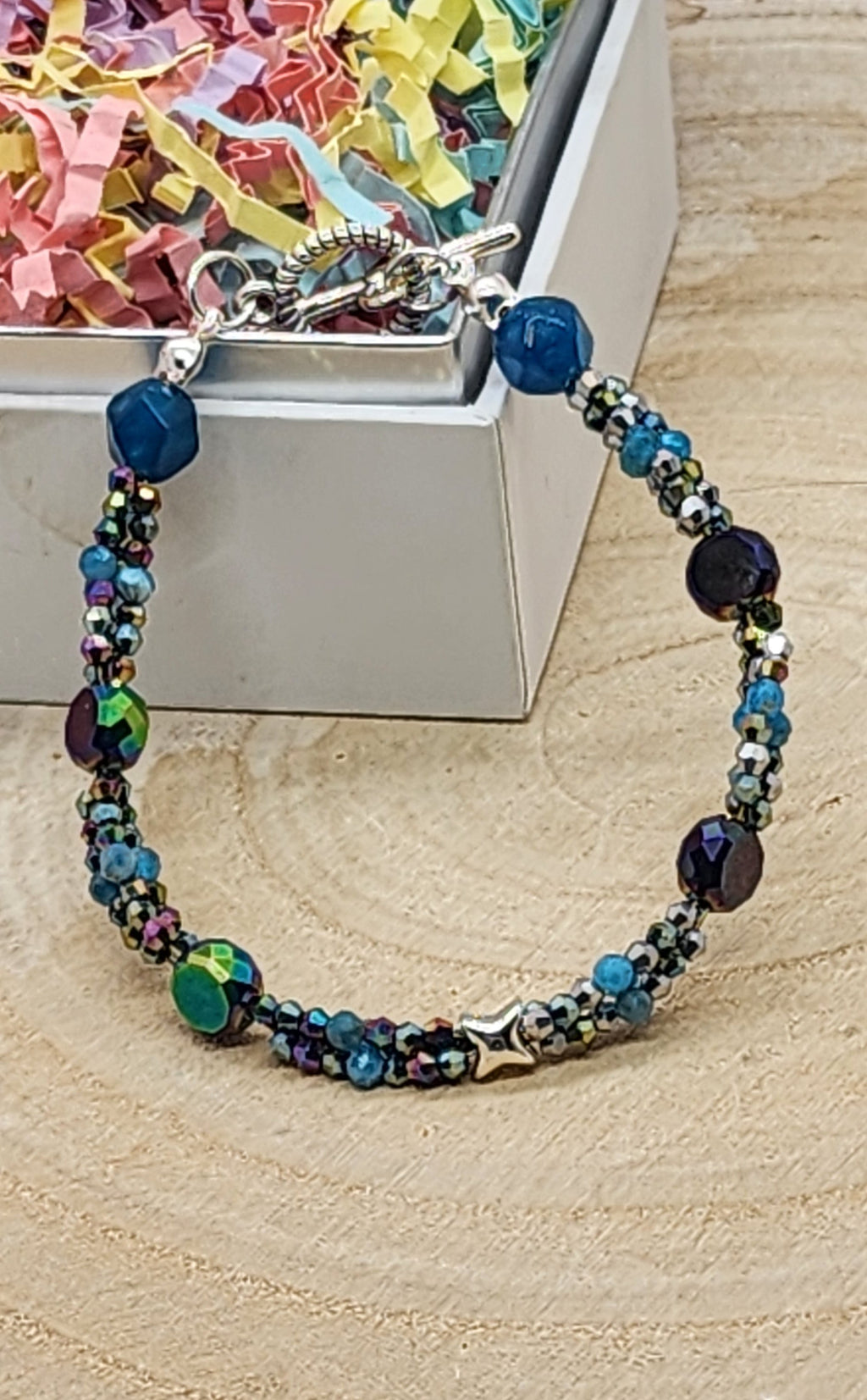 Multicolored beaded bracelet on a wooden surface