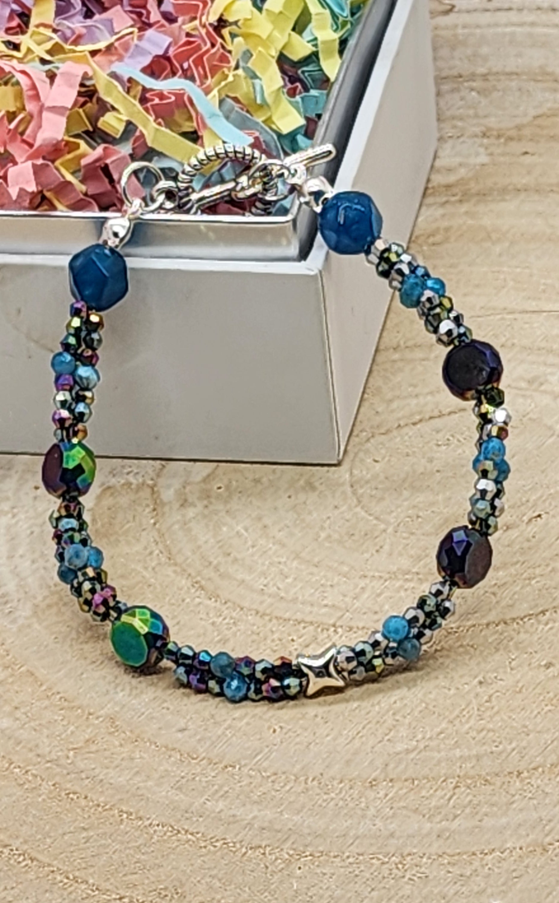 Multicolored beaded bracelet on a wooden surface