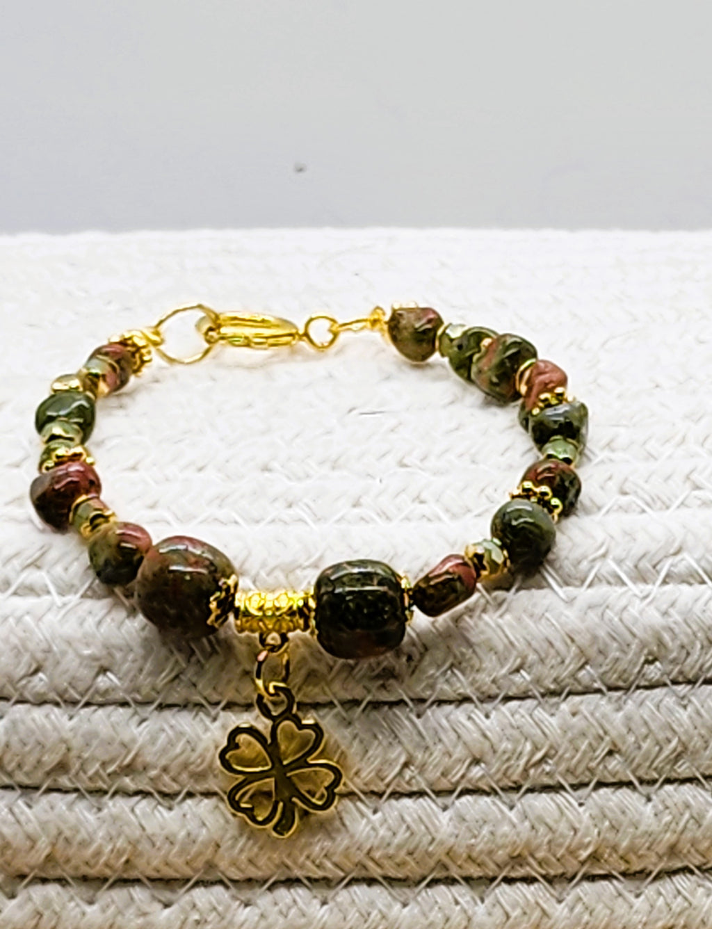 St. Patrick's Day beaded gemstone bracelet with gold or silver tone accents and charm