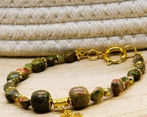 St. Patrick's Day beaded gemstone bracelet with gold or silver tone accents and charm