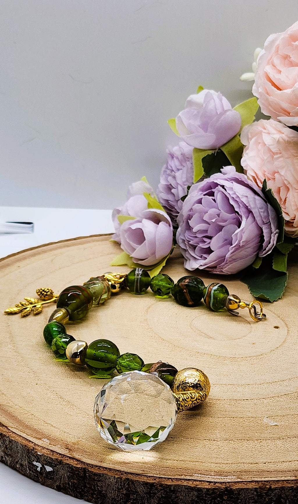 Handmade Green Glass Suncatcher with 30mm Crystal Prism and gold-colored accents