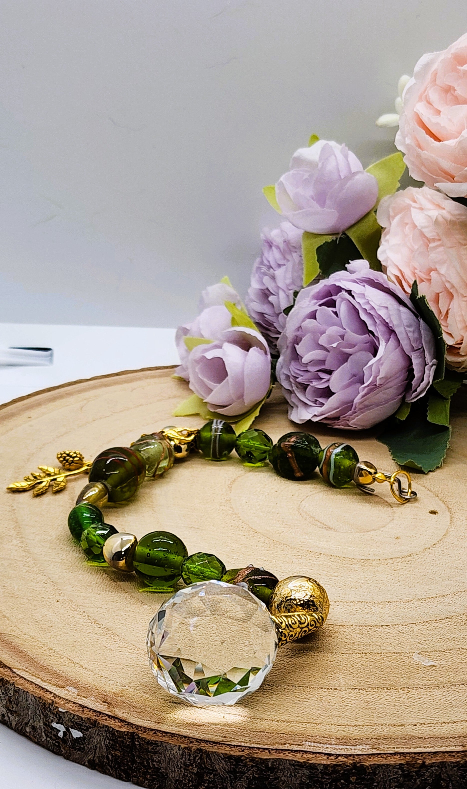 Handmade Green Glass Suncatcher with 30mm Crystal Prism and gold-colored accents