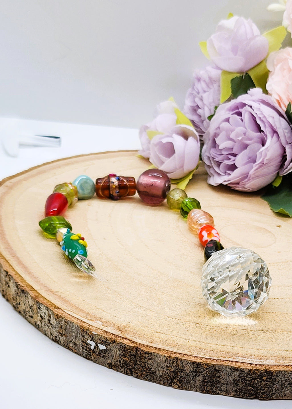 Handmade beaded suncatcher with colorful glass beads and a 30mm crystal prism ball