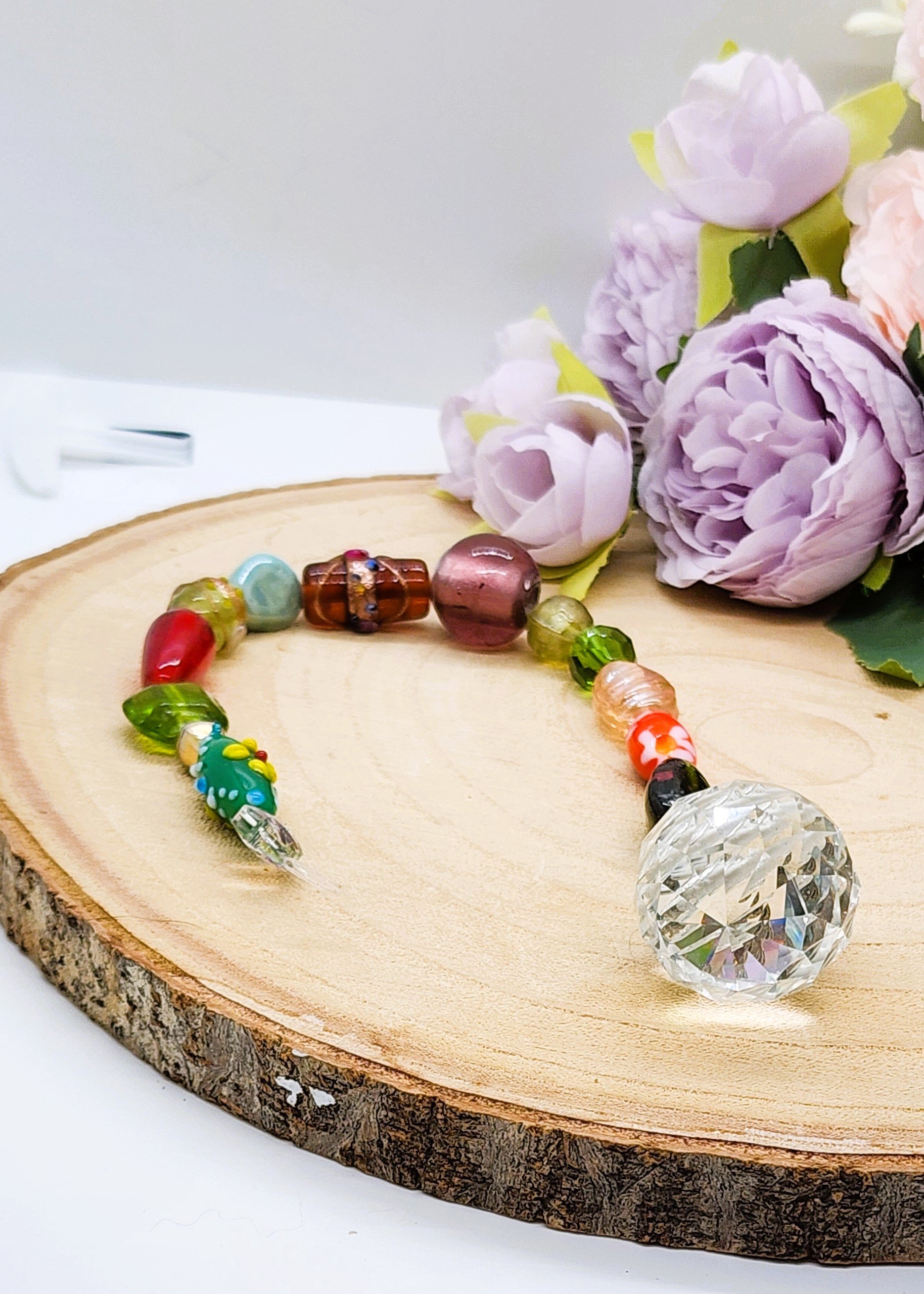 Handmade beaded suncatcher with colorful glass beads and a 30mm crystal prism ball
