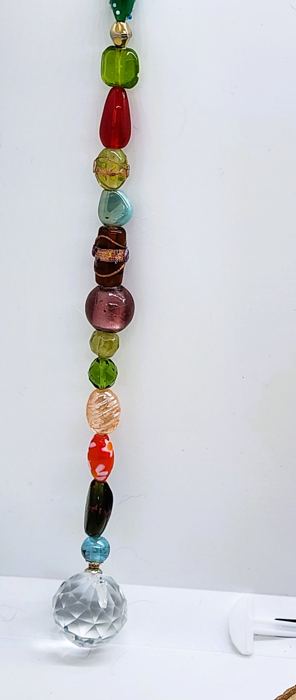 Handmade beaded suncatcher with colorful glass beads and a 30mm crystal prism ball