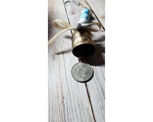 Wooden Christmas ornaments with cowbell. Blue and white with silver galvanized star on a burlap ribbon. Christmas decor