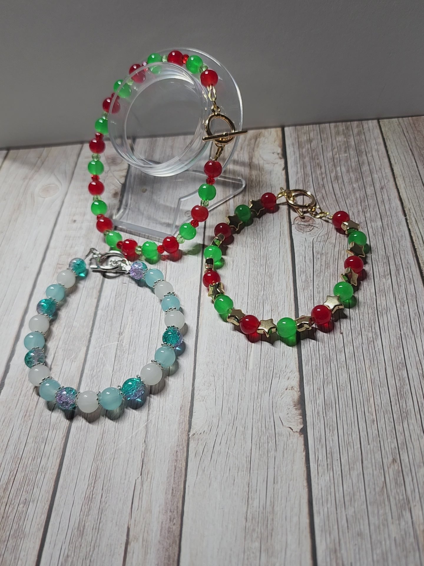 Elegant red and green glass bead Christmas bracelets with dazzling gold accents andspacer beads