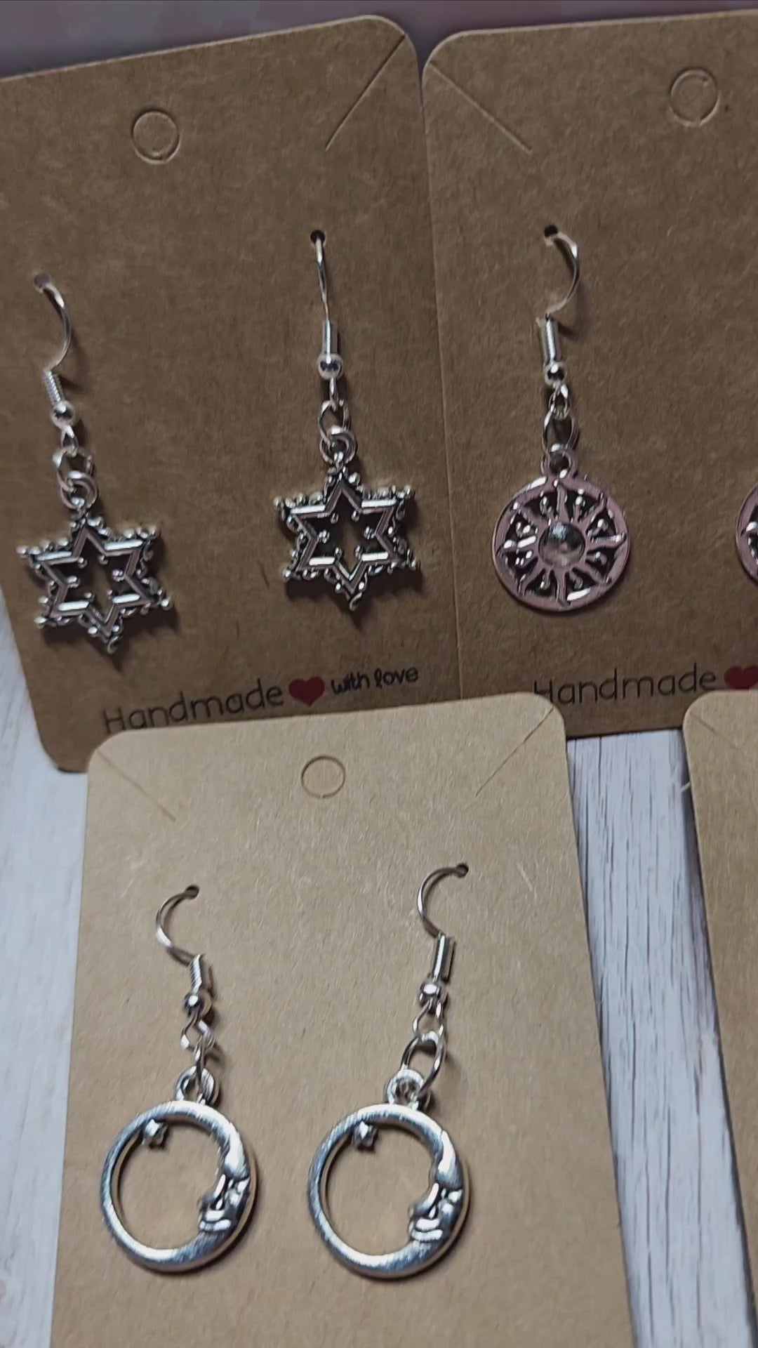 Boho style silver celestial dangle earrings sun moon and star charms