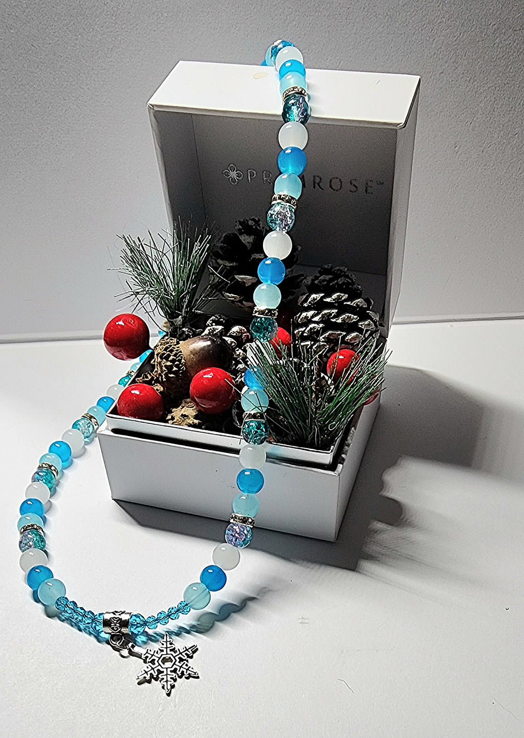 Silver winter themed blue and white glass beaded necklace with silver and rhinestone spacer beads. Christmas gift, holiday accessory.