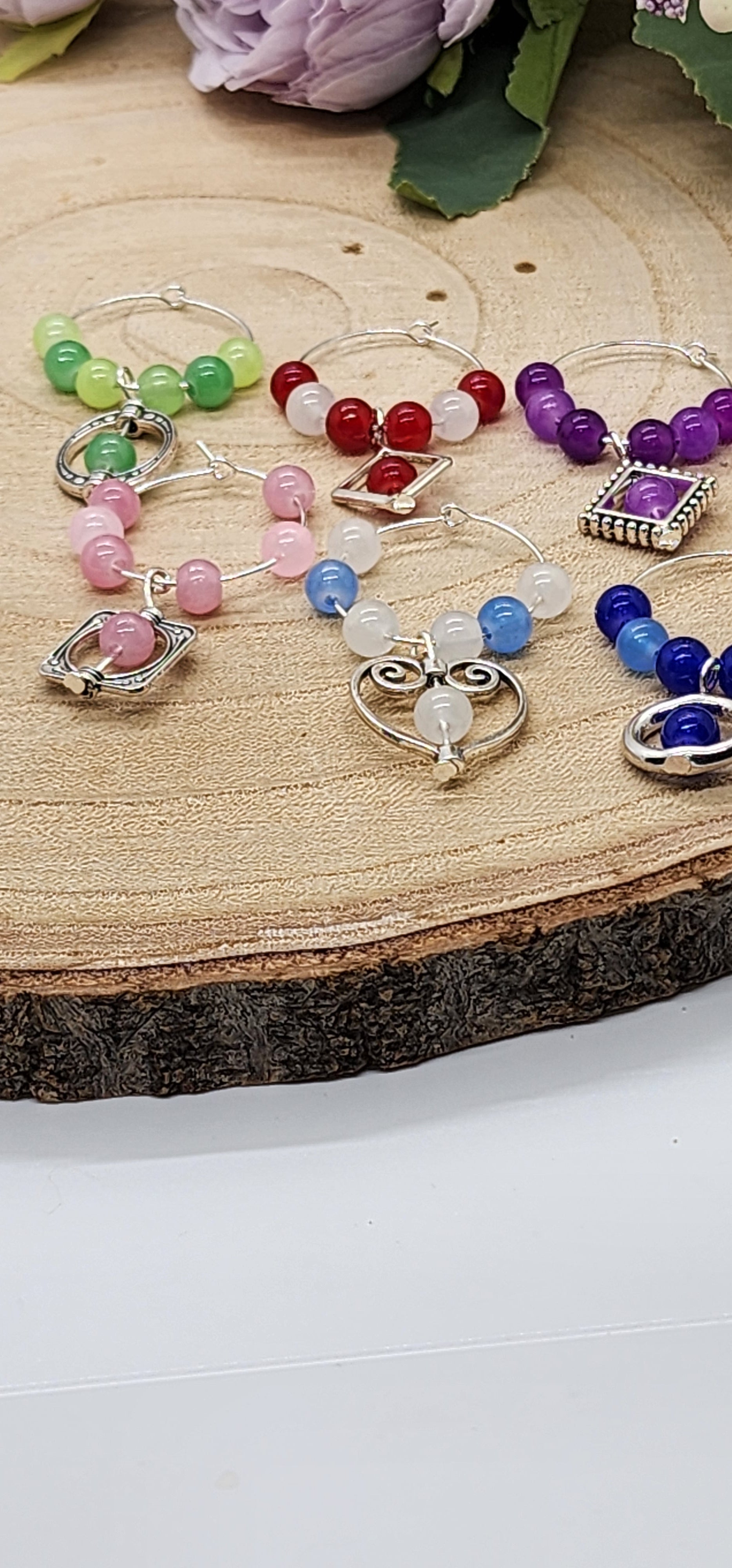 Wine glass markers with glass and gemstone beads and various themes of charms