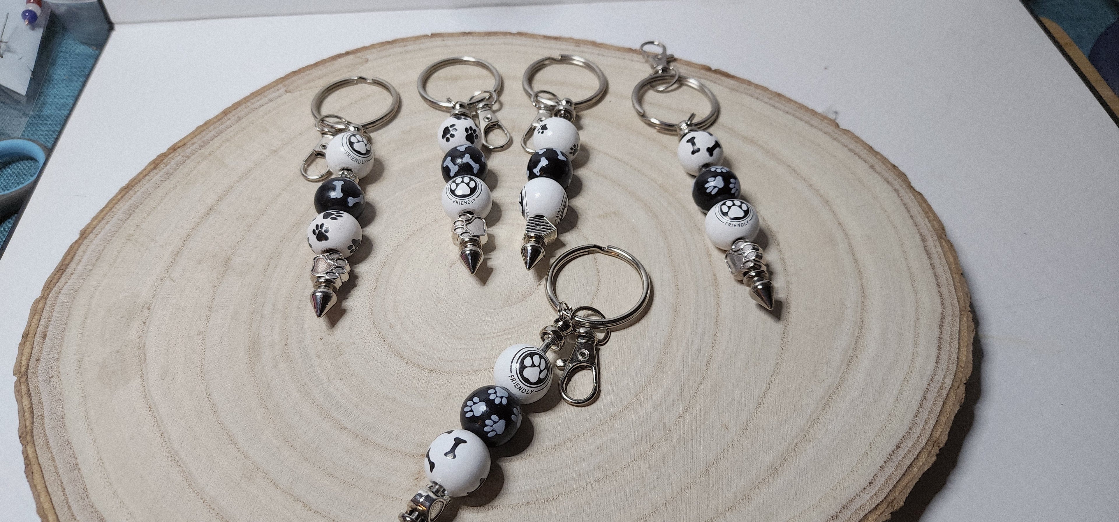 Handcrafted Wooden Pawprint Keychains in gold or silver color