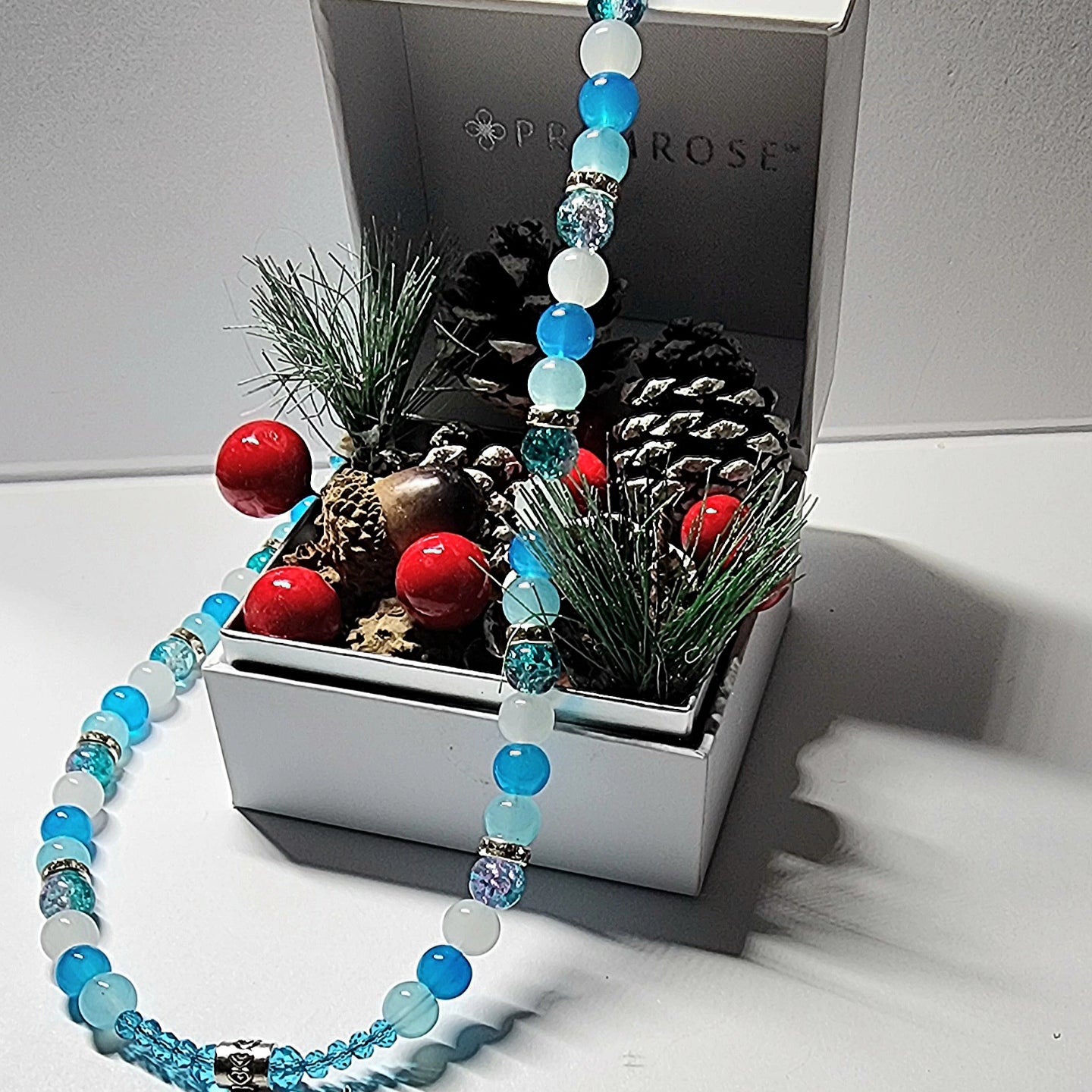Silver winter themed blue and white glass beaded necklace with silver and rhinestone spacer beads. Christmas gift, holiday accessory.