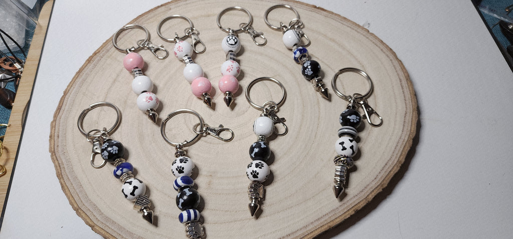 Handcrafted Wooden Pawprint Keychains in gold or silver color
