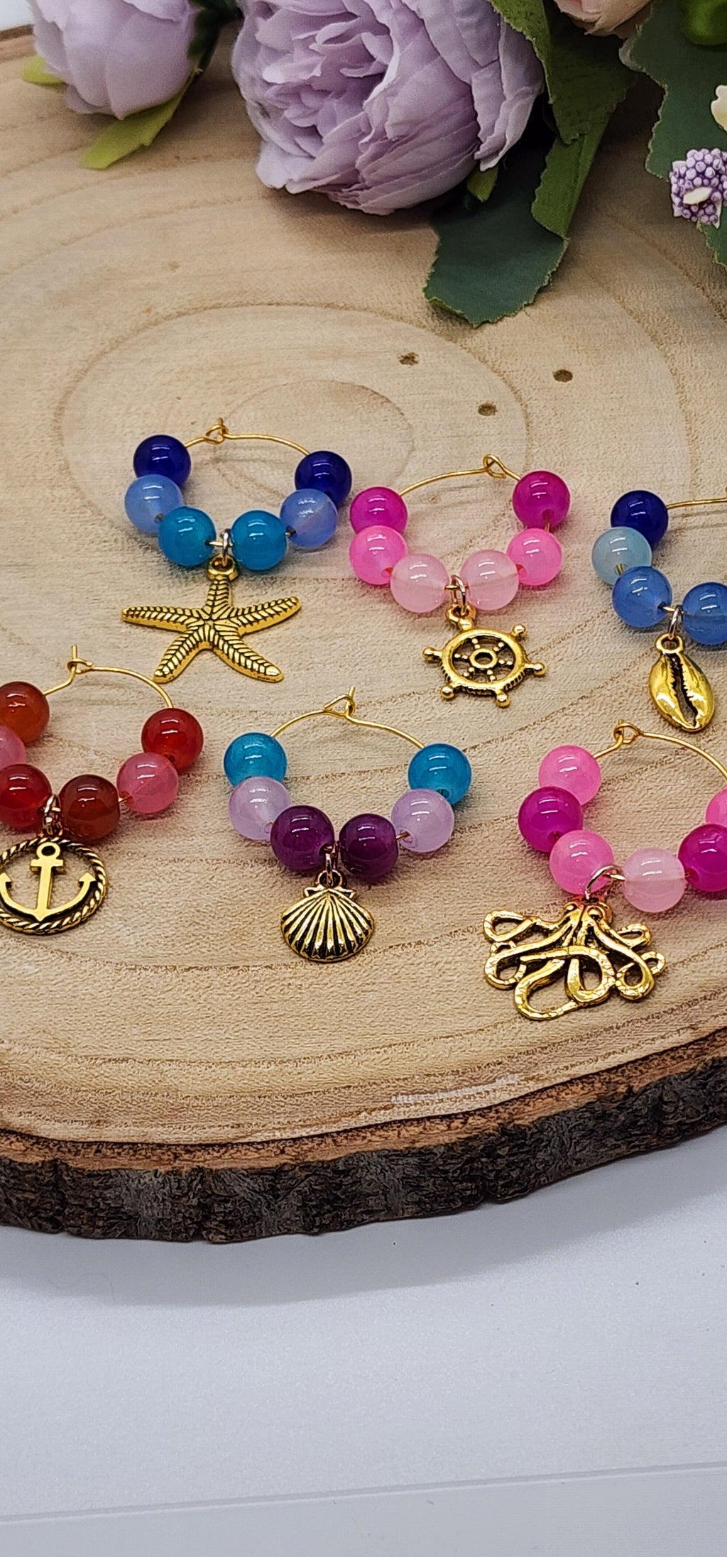 Wine glass markers with glass and gemstone beads and various themes of charms