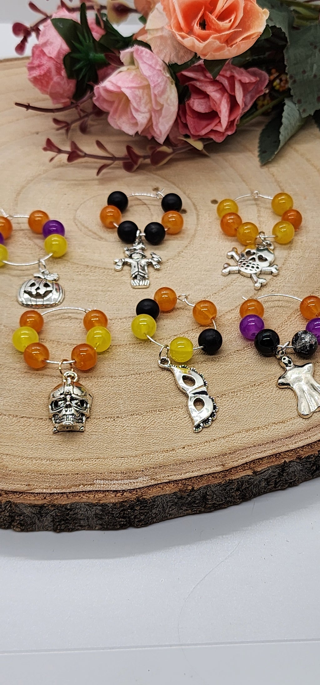 Wine glass markers with glass and gemstone beads and various themes of charms