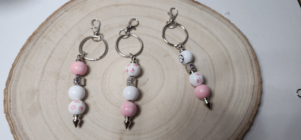 Handcrafted Wooden Pawprint Keychains in gold or silver color