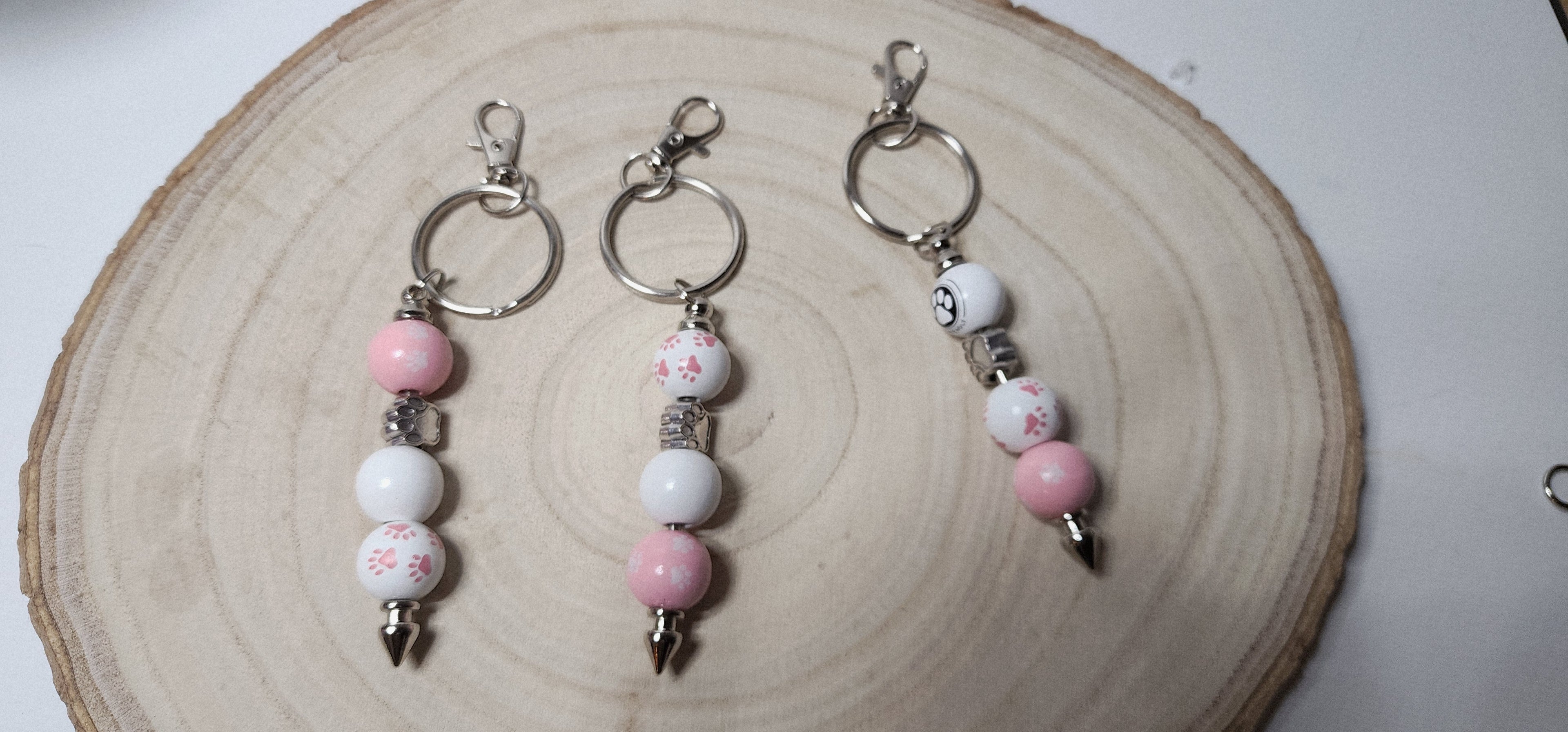 Handcrafted Wooden Pawprint Keychains in gold or silver color